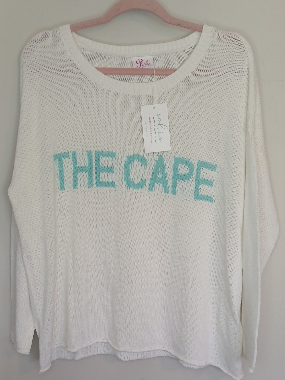 PINK PINEAPPLE NWT White Knit Sweater with Turquoise "THE CAPE" Text $120 RETAIL